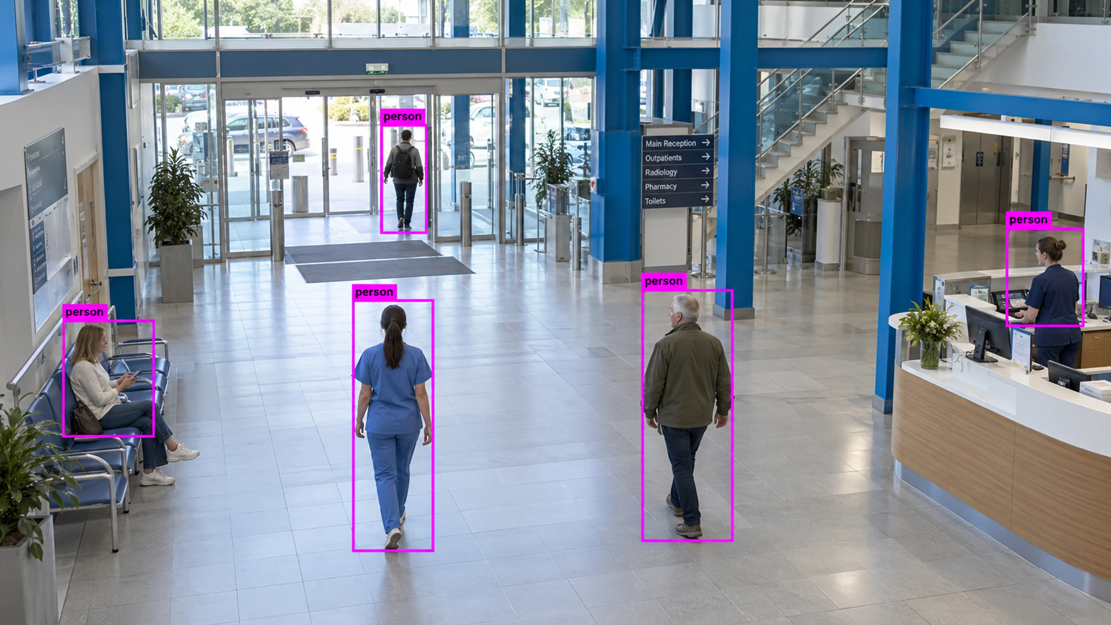 Hospital public circulation area with staff and visitors. Illustrative object detections.