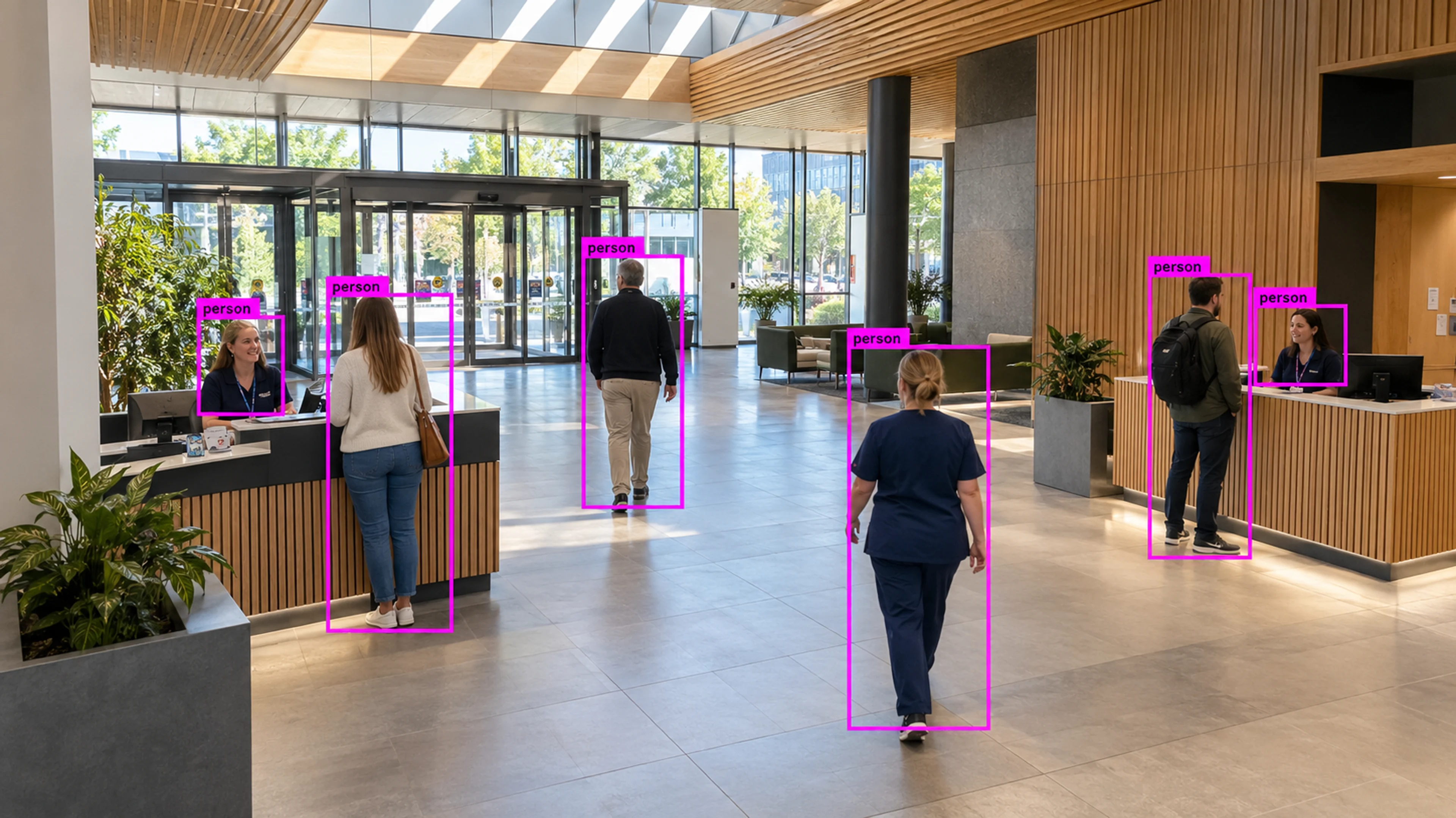 Hospital public circulation area with staff and visitors. Illustrative object detections.